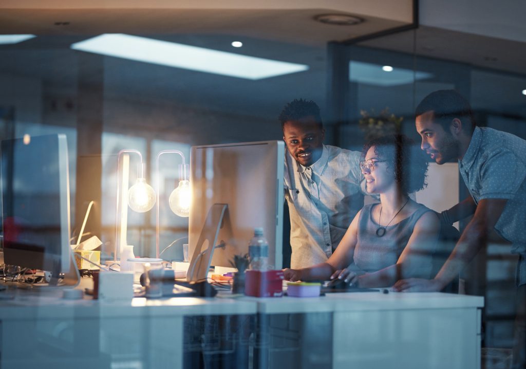 team members in office at a computer