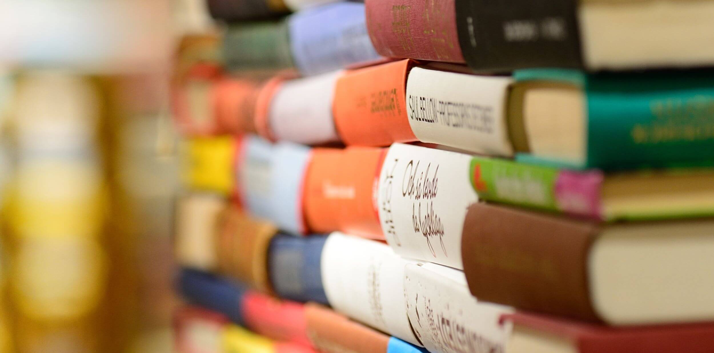 Close up of several piles of books